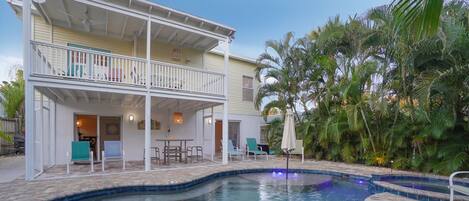 Heated saltwater pool and hot tub with screened porch & patio. 
