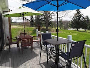 EXTERIOR:  The fun outdoor dining tables on the back patio.