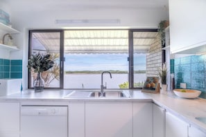 Kitchen window directly facing the Maroochy River.