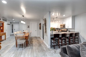 View of the fully-equipped kitchen and dining area