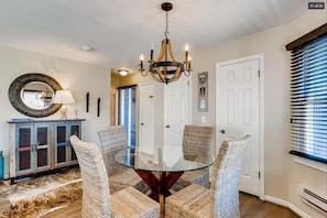 A refined dining area near the living area is an ideal place to enjoy a delicious meal or set up your favorite board game with seating for four.