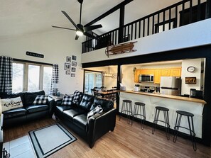 New furniture in living room with extra seating at the breakfast bar. 