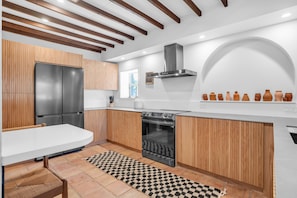 Updated & Modern kitchen with SS fridge and stove. Custom make cabinets
