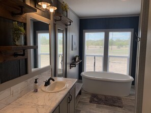 Master bathroom with separate soaking tub and stand alone shower. 