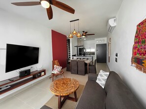 Relax in your open-plan lounge, dining area, and kitchen-adorned with craft.