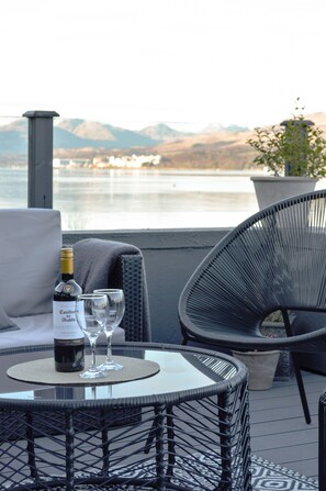 Secluded terrace views across the loch