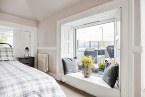 The double bedroom has direct access to the open terrace and stunning loch views
