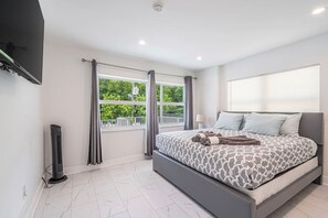 Modern sanctuary: This chic bedroom is the perfect place to unwind and recharge, with its calming color palette and plush furnishings.