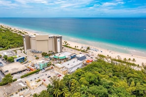 "Paradise found: This picture-perfect beach is the epitome of relaxation, with crystal-clear waters, soft sand, and swaying palm trees."