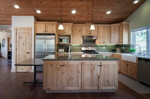 Large island, two sinks, pantry closet, solid wood cabinets