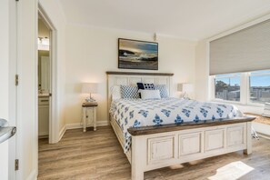 Spacious master bedroom with comfy king bed and plenty of views to enjoy.