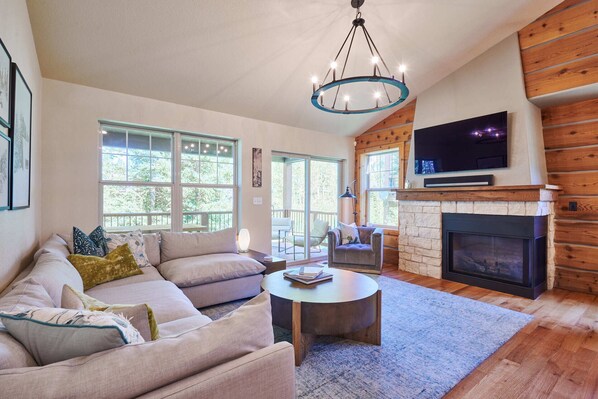 Luxurious living room with 55" TV and cozy fireplace!