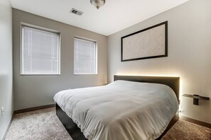 Bedroom Features:
 - 12 Inch King sized Latex & Memory foam 
    Hybrid Mattress
 - Adjustable ambient lighting behind the 
    headboard of the bed.
 - Floating night stands
 - Pull out storage containers beneath the bed.
 - Blackout curtains (new)