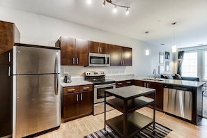 Kitchen Features:
- Island with storage
- Dishwasher
- Stainless steel stove
- Stainless steel oven
- Stainless steel refrigerator 
- Keurig Coffee maker
- Toaster
- Blender
- Pots and pans
- Dinning ware