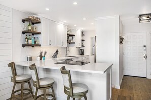 Kitchen with breakfast bar and completely remodeled