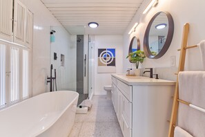 Primary en suite bathroom with tub.