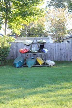 6 kayaks(red one is a double), 
2 canoes, 3 paddle boards, 8 bikes