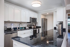 Modern open kitchen stocked with all basic cooking & basic essentials.  Stay in and cook your faves!