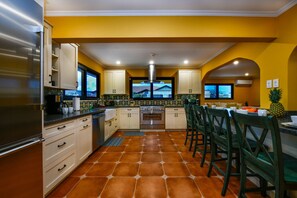 Resplendent Kitchen Area of the Apartment in Noord Aruba - Personalized touches, such as decorative tiles  - Aesthetic cohesion with matching hardware and fixtures - Open shelving for easy access to frequently used items