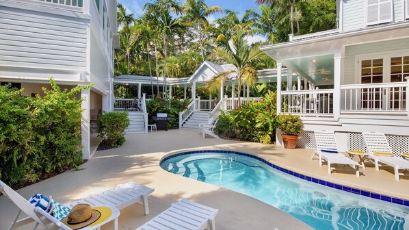 Beyond the pool is the covered walkway between the 2 homes...