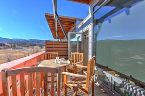 Balcony bistro seating with mountain views