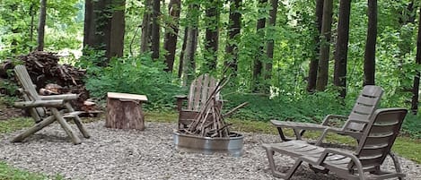 Hillside firepit. During the summer months, there is a hammock nearby to use