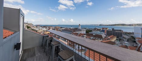 The balcony is a great place to sip on a glass of wine overlooking the river. #balcony #view #city