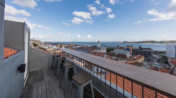 The balcony is a great place to sip on a glass of wine overlooking the river. #balcony #view #city