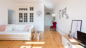 Beautifully decorated and spacious living area with a sofa-bed for 2 and a TV #porto #portugal #airbnb #beautiful #spacious