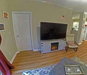 Living room with 65" TV and Electric Fireplace