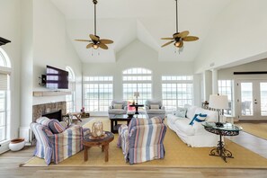 Bright and airy living area with wall of windows