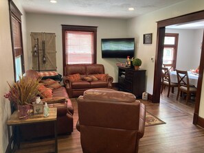 Living Room with a 55” Curved Smart TV  