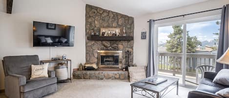 Cozy living area with wood burning fireplace