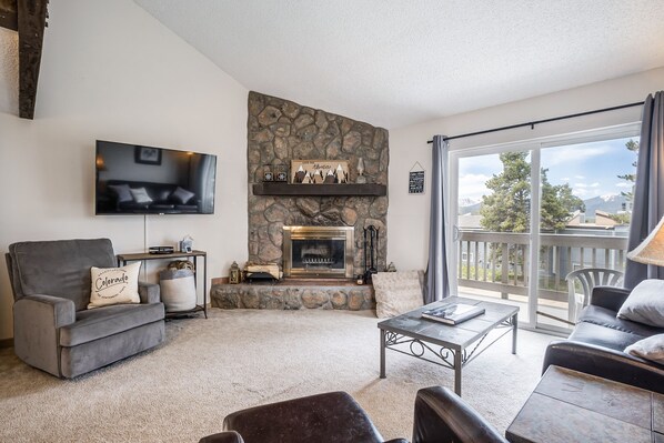 Cozy living area with wood burning fireplace