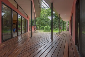 Deck connecting two sides of the home, bedrooms to living room area.