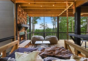 Cozy seating and beautiful views make this outdoor living space an ideal spot to enjoy the fresh mountain air.