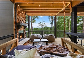 Cozy seating and beautiful views make this outdoor living space an ideal spot to enjoy the fresh mountain air.