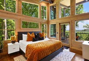 Luxurious bedding, stylish accents, and peaceful views make this king suite a serene and relaxing retreat for restful nights.