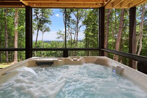 Soak your stress away with a view from our 6-person luxe hot tub