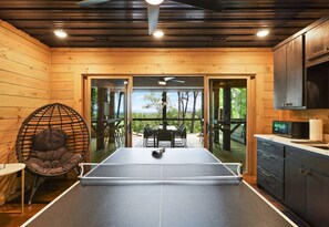 This stylish recreation area invites friendly competition with a full-size ping pong table and plenty of natural light.
