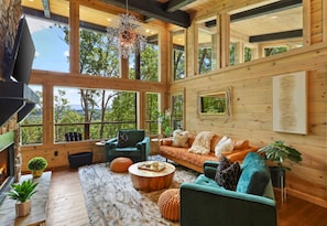 This inviting living room strikes the perfect balance of comfort and style, offering an ideal place to gather and connect.
