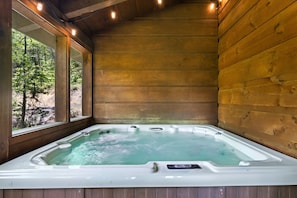 Hot tub in screened room on main deck. Accessed from deck & main level bedroom.
