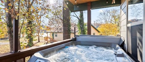 Private Hot Tub for 4 on the deck, looking out toward the lake.