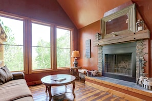 Main floor living area with wood fireplace