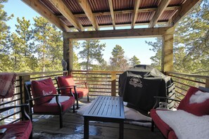 Upper deck just off of the kitchen, perfect for grilling, entertaining, or enjoying your morning coffee
