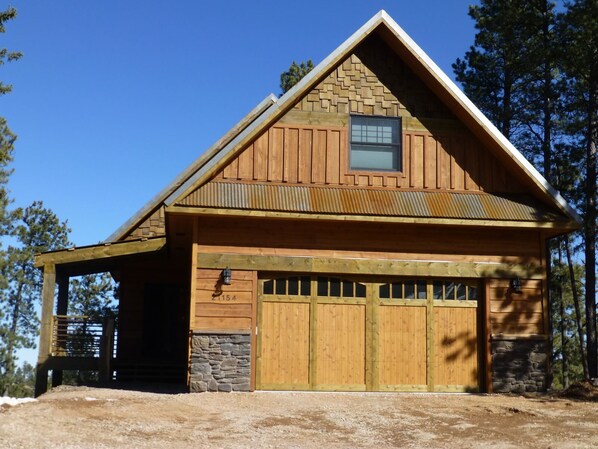 Front side of the cabin, featuring the full garage available for parking