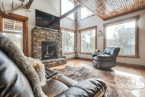 Gas fireplace and large TV in main living area