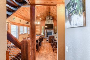 Main floor dining area, breakfast bar, and living room- view from the entry way