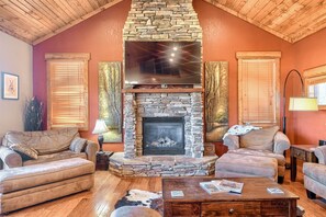 Main floor living room with cozy gas  fireplace