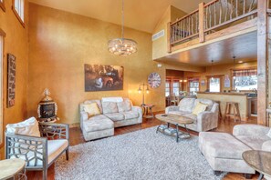 Open concept living room with kitchen and dining area